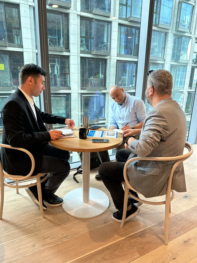 Founders receiving mentor feedback on growth plans